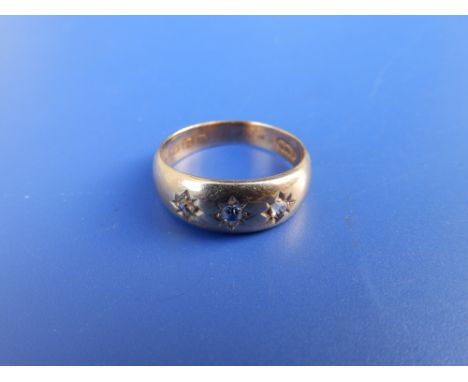 A three stone gypsy set diamond ring - Birmingham marks. Finger size K.