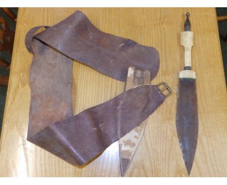 An Eastern bone-handled dagger.