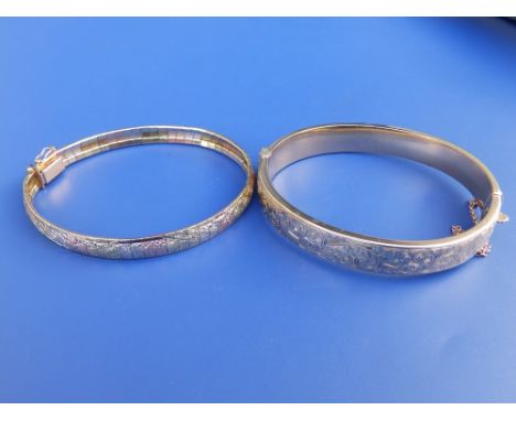 A three colour '14' yellow metal modern bracelet and a 9ct gold bangle. (2)