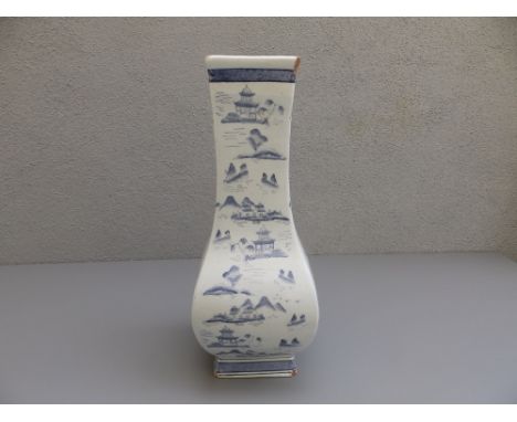 A 20thC Chinese porcelain blue &amp; white bottle vase of rectangular section,  14" high - chipped, 