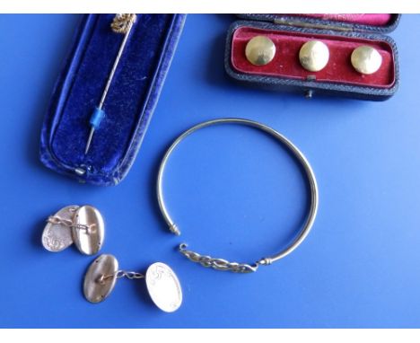 A pair of oval 9ct cufflinks, a 9ct bangle, a stick pin and three 18ct studs. (8)