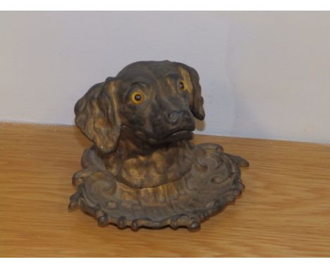 A Victorian cast iron spaniel head inkwell with glass eyes - hinge a/f, liner missing.