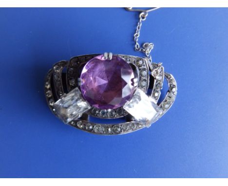 An amethyst &amp; diamond paste brooch.