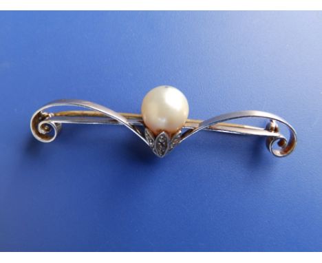 A pearl &amp; diamond set yellow metal bar brooch of scroll form,  2".