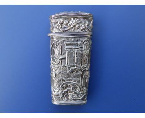 An 18thC rococo etui, having repousse decoration overall, the front showing a seated figure with a classical garden, the reve