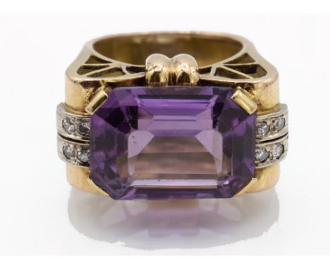 &nbsp;A retro gold amethyst and diamond ring. The ring set with an octagon step cut amethyst 12.2 x 16.8mm flanked by eight d