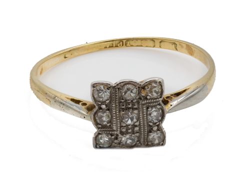 A 1920’s 18ct gold and platinum diamond ring. The ring having a square head set with 9 single cut diamonds. Estimated diamond