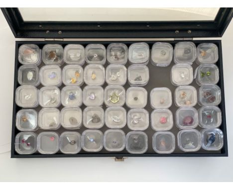 A large collection of cased Gem Collectors specimen gemstones to include:- Moonstone, Morganite, Moldavite, Opal, Ruby, Quart