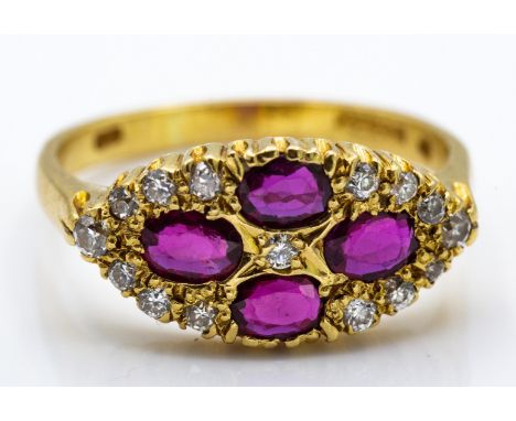 An 18ct gold ruby and diamond cluster ring. The ring set with 4 oval cut rubies within accents of diamonds. Hallmarked for Lo