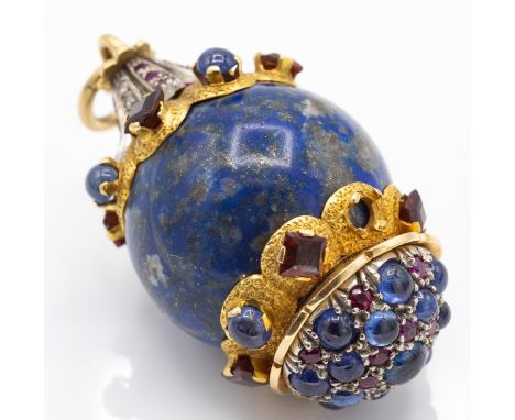 A large gold and silver mounted lapis lazuli diamond  sapphire and ruby pendant. The pendant of globe form set with sapphire 