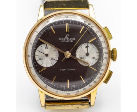 A 1960s Breitling gentleman's Top Time wristwatch, Ref 2003, the gold plated case with signed black reverse panda dial, block