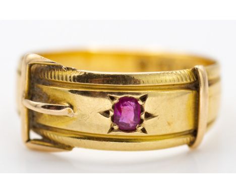 A Victorian 19th century 18ct gold hallmarked ruby buckle ring. Birmingham hallmarked for 1884, the ring with buckle design h