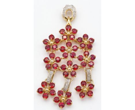 A&nbsp; large hallmarked 9ct gold and AAA Tanzanian ruby and diamond necklace pendant. The pendant strung with multiple clust