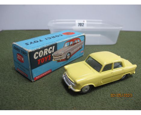 A Boxed Corgi Toys #207M Diecast Model Standard Vanguard III Saloon, primrose yellow body, flywheel motor, minor chipping to 