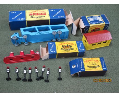 Four Boxed Matchbox 'Lesney' 1-75 Series Diecast Model Accessory Packs, comprising of No 2 car transporter, (tears/puncture h