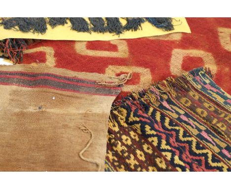 A group of Peruvian Nazca textiles, including a plangi tie-dyed camelid fragment c.400-600 CE,with loop stitch border, on a l