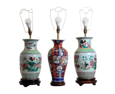 A pair of Chinese porcelain vase table lamps, modern, on wood plinths, 67.5cm to the top of shade mount, and an Imari table l