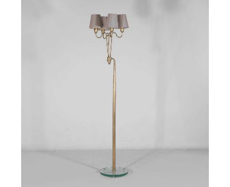 Manner of FontanaArte, a four-light floor lamp, c.1950, in brass and glass,37cm wide 37cm deep 178cm high to fittingCondition