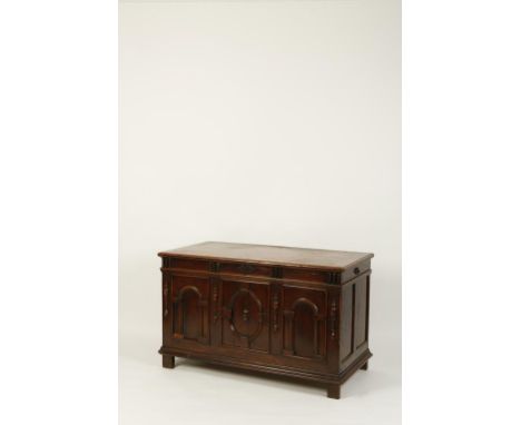 A MID-17TH CENTURY CYPRESS WOOD CHEST, the rectangular top with a single plank within a mitred surround, the front with three