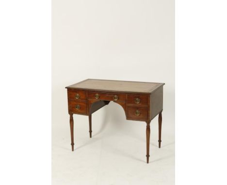 A 19TH CENTURY MAHOGANY LEATHER LINED WRITING DESK, the rectangular top with gilt tooled writing surface above an arrangement