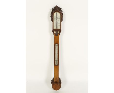 A VICTORIAM OAK FRAMED STICK BAROMETER, with twin ivory scales and mercury filled thermometer, on a carved oak mount, 38.5"