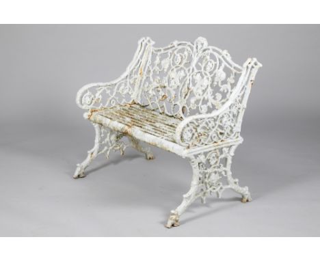 A Victorian cast iron garden seat, with floral and leaf decoration, 99cm long, 51cm deep, 86cm high. CONDITION REPORT: The ca