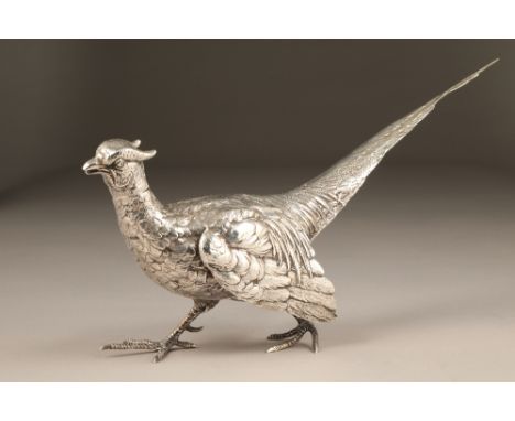1920s silver pheasant table centre piece, assay marked Sheffield 1924, 40cm long, weight 843g. CONDITION REPORT: The pheasant