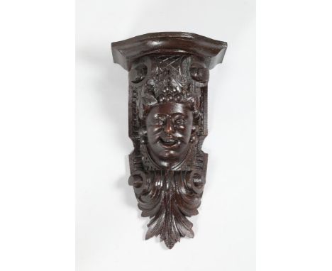Carved figure wall bracket, 50cm high, 28cm wide.