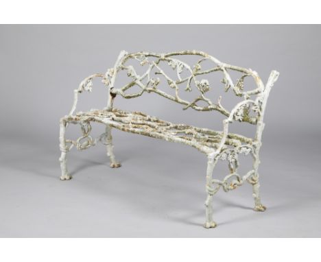 A Victorian cast iron garden seat, in the form of oak leaves and branches, 130cm long, 58cm deep, 86cm high. CONDITION REPORT