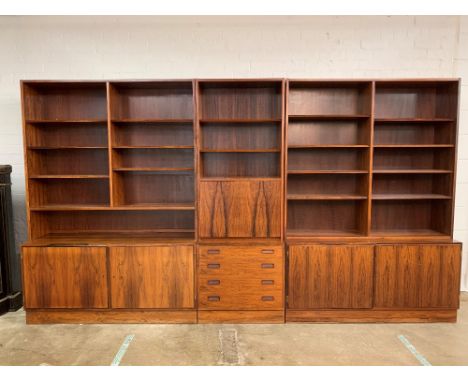 1960s Danish rosewood three piece wall unit, centre piece with open shelves over a fall front above five fitted drawers, flan