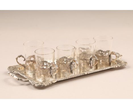 Victorian silver liqueur set, small double handled tray with six silver pierced holders with scroll handles and five glasses.