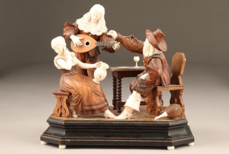 18th century German/Austrian ivory and wood group figure, modelled as a tavern scene, gent proposing to a barmaid with musici