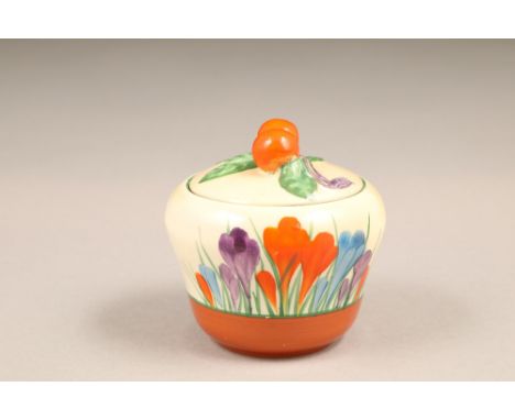 A Clarice Cliff Bizarre crocus pattern preserve pot and cover, with printed mark, 7.5cm high.CONDITION REPORT:Item is in very