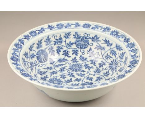 19th/20th century Chinese blue and white porcelain basin, trailing leaf and floral decoration, bats to underside, 48cm diamet