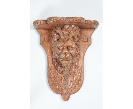 Carved oak wall bracket, with carved lion mask and thistle, 57cm high, 49cm wide.