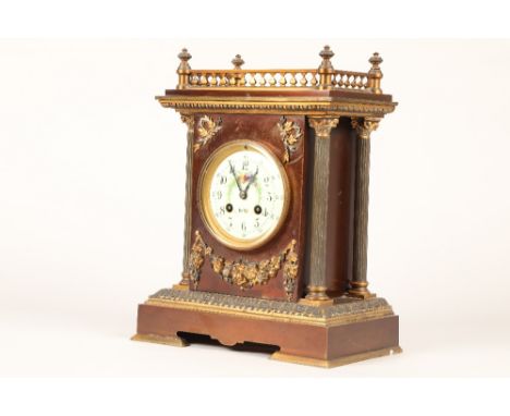 19th century French bronzed and gilt metal mantel clock, white enamelled dial. Decorated with flowers and butterflies, flanke