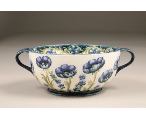 Macintyre Florianware bowl, circular with two looped handles, decorated with poppy design in blue and green on a white ground