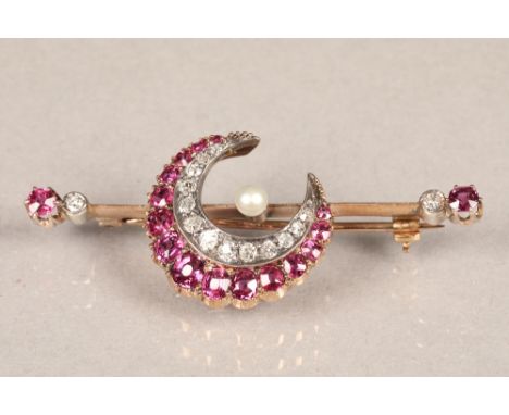 Diamond and ruby crescent brooch, set with thirteen old cut graduated diamonds and bordered with fifteen graduated rubies, a 