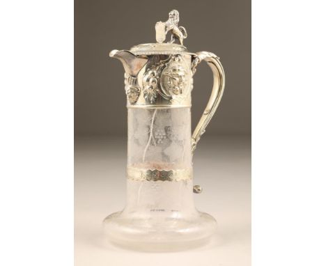 Victorian electro plated silver mounted glass decanter, scroll handle, lion and shield finial, engraved with vines and grapes