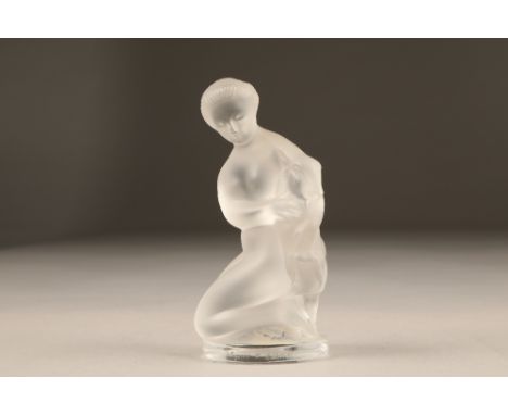 A Lalique frosted glass figure, of a nude female holding a goat, etched Lalique ( R ) France, 12 cm high.CONDITION REPORT:Fig