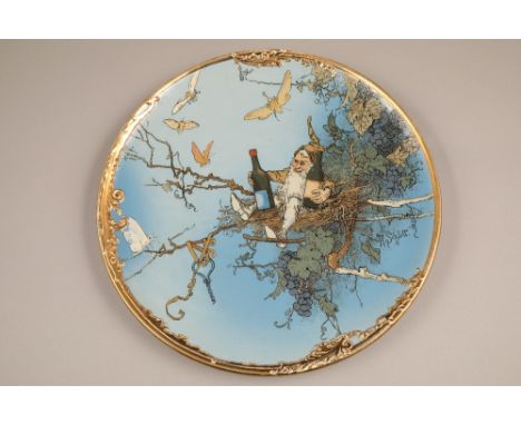 A pair of Mettlach wall plaques by Heinrich Schlitt, early 20th century. Circular decorated with incised and coloured complim