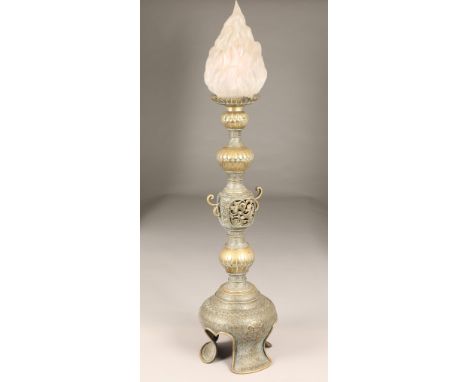 Chinese brass candle stick, turned column with a decorative pierced knop and raised on three feet, modified for electric.  75