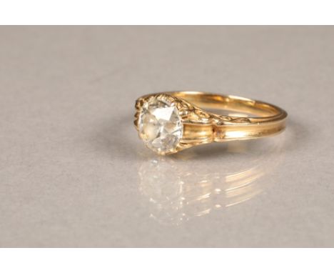 Ladies diamond solitaire ring, 1.2 carat old cut diamond in a scroll setting in unmarked yellow metal. Ring size L/M. CONDITI