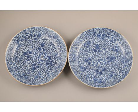 Pair 18th/19th century Chinese chargers, blue and white floral decoration, 34cm diameter. CONDITION REPORT: One charger is in
