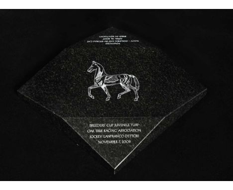 A Breeders' Cup Juvenile Turf stone plaque, awarded to Frankie Dettori, 
the central panel with a stylised anatomical sketch 