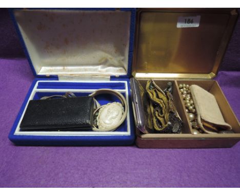 A brass cigarette box and jewellery case containing a small selection of costume jewellery etc including beaded belt, serpent