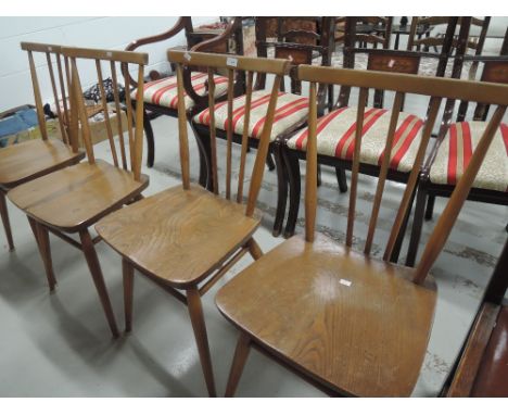 A set of four Ercol stick back kitchen chairs