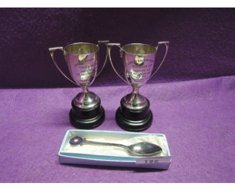 A pair of HM small silver trophies of urn form having presentation inscriptions regarding  'the best front garden on the Mott