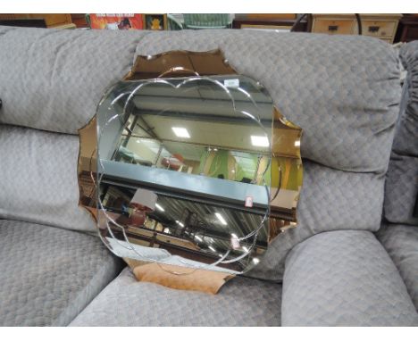 A vintage wall mirror , with copper coloured glass decoration