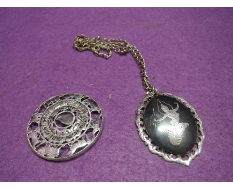 A white metal pendant stamped sterling Siam depicting an oriental dancer on an HM silver chain, and an Indian style white met